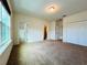 Bedroom with large windows, carpet flooring, and access to a bathroom and closet at 4900 Beach Blvd, Orlando, FL 32803