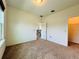 This bedroom features neutral walls, carpeted floors, and ample natural light from the large window at 4900 Beach Blvd, Orlando, FL 32803