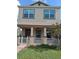 Charming two-story home with a welcoming front porch and well-maintained landscaping at 4900 Beach Blvd, Orlando, FL 32803