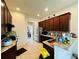 Modern kitchen featuring granite countertops and dark cabinetry at 4900 Beach Blvd, Orlando, FL 32803