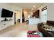 Spacious living room featuring an open layout with tiled floors and dark cabinetry at 4900 Beach Blvd, Orlando, FL 32803