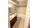 Bathroom with a granite vanity, sink, toilet, and shower-tub combo at 5116 Conroy Rd # 411, Orlando, FL 32811