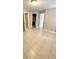 Bedroom with tile flooring, neutral walls and open closet at 5116 Conroy Rd # 411, Orlando, FL 32811