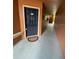 Exterior entryway featuring welcome mat and blue door at 5116 Conroy Rd # 411, Orlando, FL 32811