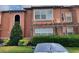 Two-story condo building with well-maintained landscaping and stucco exterior at 5116 Conroy Rd # 411, Orlando, FL 32811