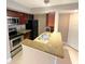 Kitchen featuring granite countertops and stainless steel appliances at 5116 Conroy Rd # 411, Orlando, FL 32811