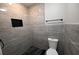 Sleek bathroom with stylish gray tile, modern fixtures, and a built-in shower niche at 5118 Log Wagon Rd, Ocoee, FL 34761