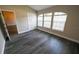 Bedroom featuring vinyl flooring, arched windows, and a closet at 5118 Log Wagon Rd, Ocoee, FL 34761