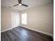 This bedroom is painted neutral and has a ceiling fan, window and large closet at 5118 Log Wagon Rd, Ocoee, FL 34761