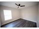 Bright bedroom with a window, neutral paint, and modern flooring at 5118 Log Wagon Rd, Ocoee, FL 34761