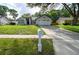 Charming single-story home with a well-maintained lawn and inviting curb appeal at 5118 Log Wagon Rd, Ocoee, FL 34761