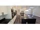 Modern kitchen design with a large island, stainless steel appliances, white cabinets, and open floor plan at 5118 Log Wagon Rd, Ocoee, FL 34761