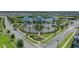 Aerial view of the community clubhouse, showcasing parking and beautifully landscaped grounds at 720 Gardenia Ln, Davenport, FL 33897