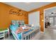 Cozy bedroom with custom paint, unique character themes, and ample closet space at 720 Gardenia Ln, Davenport, FL 33897