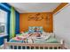 Playful bedroom with a unique, bright color scheme and character-themed decor at 720 Gardenia Ln, Davenport, FL 33897