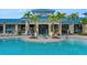 Beautiful resort style pool with palm trees at the clubhouse at 720 Gardenia Ln, Davenport, FL 33897