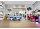 A fun game room with air hockey and racing games, perfect for Gathering entertainment at 720 Gardenia Ln, Davenport, FL 33897