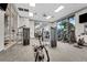 Well-equipped gym featuring modern fitness equipment and ample natural light at 720 Gardenia Ln, Davenport, FL 33897