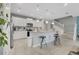 Bright kitchen with white cabinetry, granite countertops, stainless steel appliances and breakfast bar seating at 720 Gardenia Ln, Davenport, FL 33897