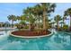 Scenic lazy river with island landscaping offering a tranquil escape in a lush setting at 720 Gardenia Ln, Davenport, FL 33897