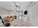 Comfortable living area with modern furnishings, gaming chairs, and decorative rug at 720 Gardenia Ln, Davenport, FL 33897