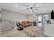 Upstairs loft area with comfortable seating, gaming chairs, and neutral decor at 720 Gardenia Ln, Davenport, FL 33897