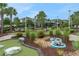 A close up of the the community's beautifully landscaped and fun mini golf area at 720 Gardenia Ln, Davenport, FL 33897