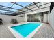 Relax in this refreshing pool surrounded by a screened enclosure and ample patio space at 720 Gardenia Ln, Davenport, FL 33897