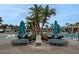 Inviting poolside lounge area with stylish seating and umbrellas for ultimate comfort at 720 Gardenia Ln, Davenport, FL 33897