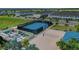 Community recreation area with a basketball court, sand volleyball court, and green space at 720 Gardenia Ln, Davenport, FL 33897