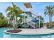 Exciting water slide with lush landscaping, offering a thrilling recreational experience at 720 Gardenia Ln, Davenport, FL 33897