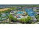 Aerial view of the waterpark featuring pools, water slides, and lush landscaping at 720 Gardenia Ln, Davenport, FL 33897