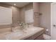 Bright bathroom featuring double sinks, modern vanity, patterned tile, and ample counter space at 7461 Bleecker Ln, Kissimmee, FL 34747