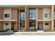 Modern townhome featuring a contemporary design with large windows and a well-maintained facade at 7461 Bleecker Ln, Kissimmee, FL 34747