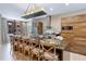 Stylish kitchen island with seating and modern appliances, ideal for gatherings at 7461 Bleecker Ln, Kissimmee, FL 34747