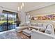Inviting living area with outdoor views, perfect for relaxing and entertaining at 7461 Bleecker Ln, Kissimmee, FL 34747