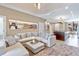 Comfortable living room featuring a large sectional sofa and stylish decor at 7461 Bleecker Ln, Kissimmee, FL 34747