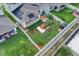 Aerial view of the home showing the landscaped yard, pond, and covered back patio at 7639 Agrigento St, Clermont, FL 34714