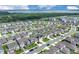 Expansive view of a residential community near a lake, blending modern homes with nature's backdrop under a bright sky at 7639 Agrigento St, Clermont, FL 34714