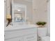 Well-lit bathroom with quartz countertops and decorative accents at 7639 Agrigento St, Clermont, FL 34714