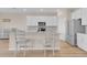 Stylish eat-in kitchen with stainless steel appliances and a large island at 7639 Agrigento St, Clermont, FL 34714
