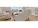 Bright living room featuring neutral walls and hardwood flooring at 7639 Agrigento St, Clermont, FL 34714