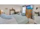 Comfortable main bedroom featuring plenty of storage and a television at 7639 Agrigento St, Clermont, FL 34714
