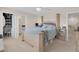 Spacious main bedroom with walk-in closet and four-poster bed at 7639 Agrigento St, Clermont, FL 34714