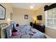 Cozy bedroom with two beds, Mickey Mouse themed decor, and a ceiling fan at 7660 Comrow St # 203, Kissimmee, FL 34747