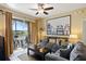 Cozy living room with a large window, comfortable seating, and stylish accents at 7660 Comrow St # 203, Kissimmee, FL 34747
