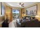 Comfortable living room with a balcony view and neutral decor at 7660 Comrow St # 203, Kissimmee, FL 34747