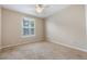 Bedroom featuring a window, a ceiling fan, plush carpeting, and neutral paint at 8168 Boat Hook Loop # 201/718, Windermere, FL 34786