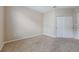 Cozy bedroom with neutral paint, plush carpet, and a double door closet at 8168 Boat Hook Loop # 201/718, Windermere, FL 34786