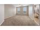 Spacious bedroom features natural light, carpeted floors and ensuite bath at 8168 Boat Hook Loop # 201/718, Windermere, FL 34786